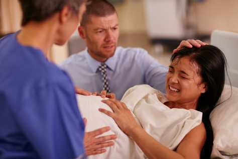 woman in labour with partner