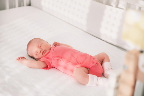 Is baby ready to sleep in a cot 474