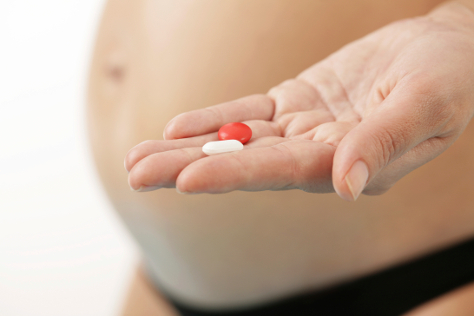 Pregnant woman taking folic acid