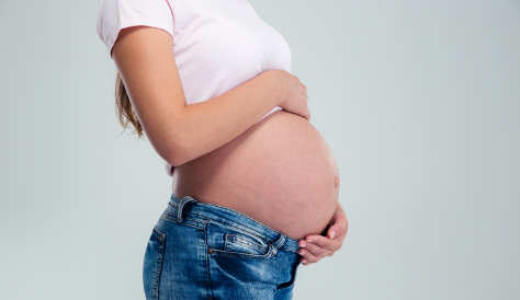 Pregnant woman in maternity jeans