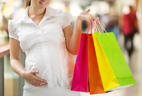 Pregnant woman shopping maternity wear